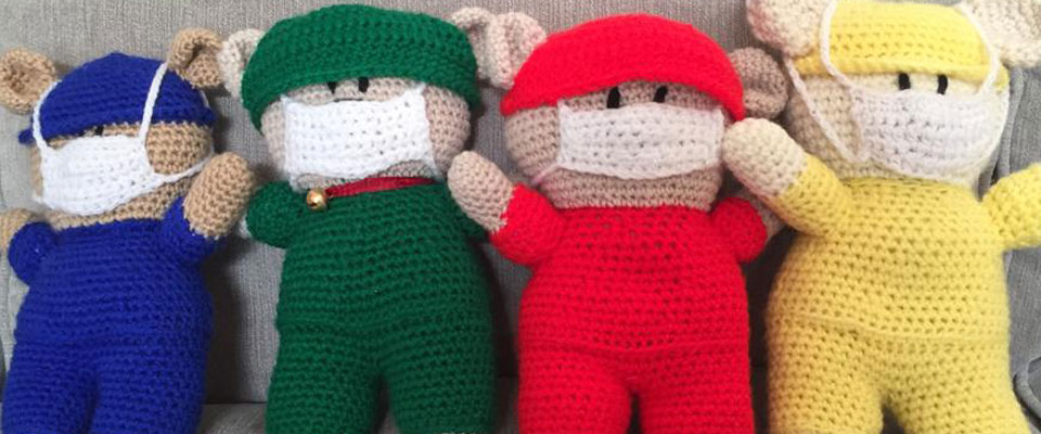 knitted toys wearing face masks