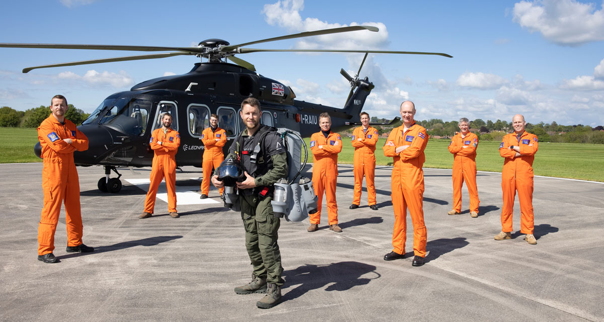 Gravity Industries founder and Chief Test Pilot, Richard Browning, with Leonardo's test pilots in Yeovil, in front of the AW149