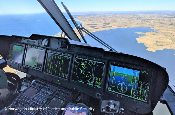 The view from inside the cockpit of a Norwegian Ministry of Justice and Public Security AW101 All-Weather Search and Rescue (AWSAR) helicopter