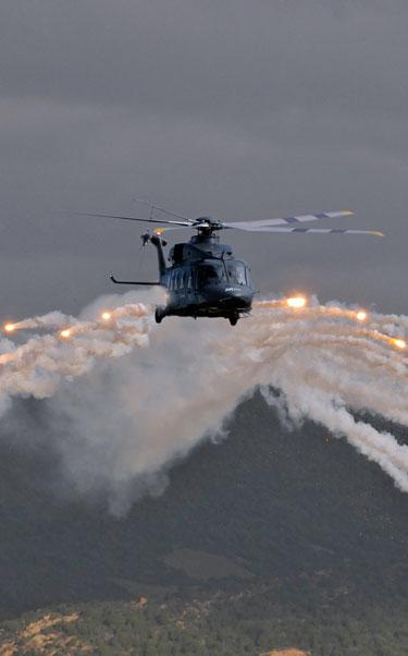 AW149 helicopter releasing chaff and flare