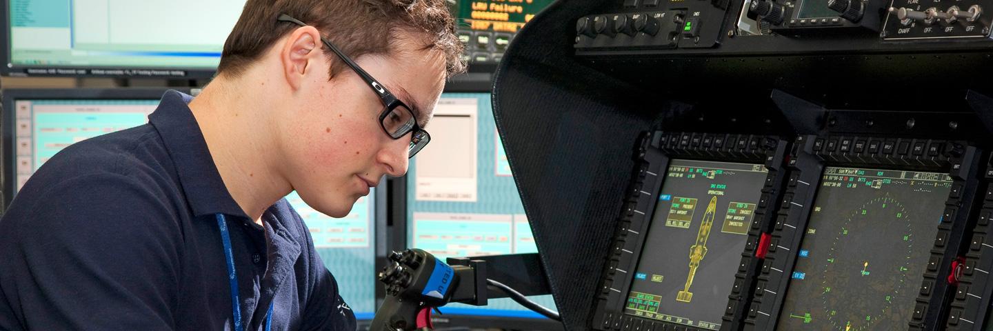 Young man in glasses works on radar