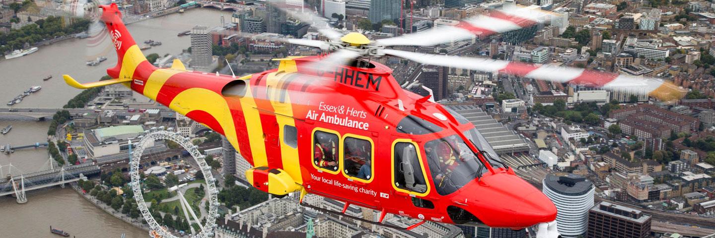 Essex & Herts Air Ambulance AW169 flies over the central London