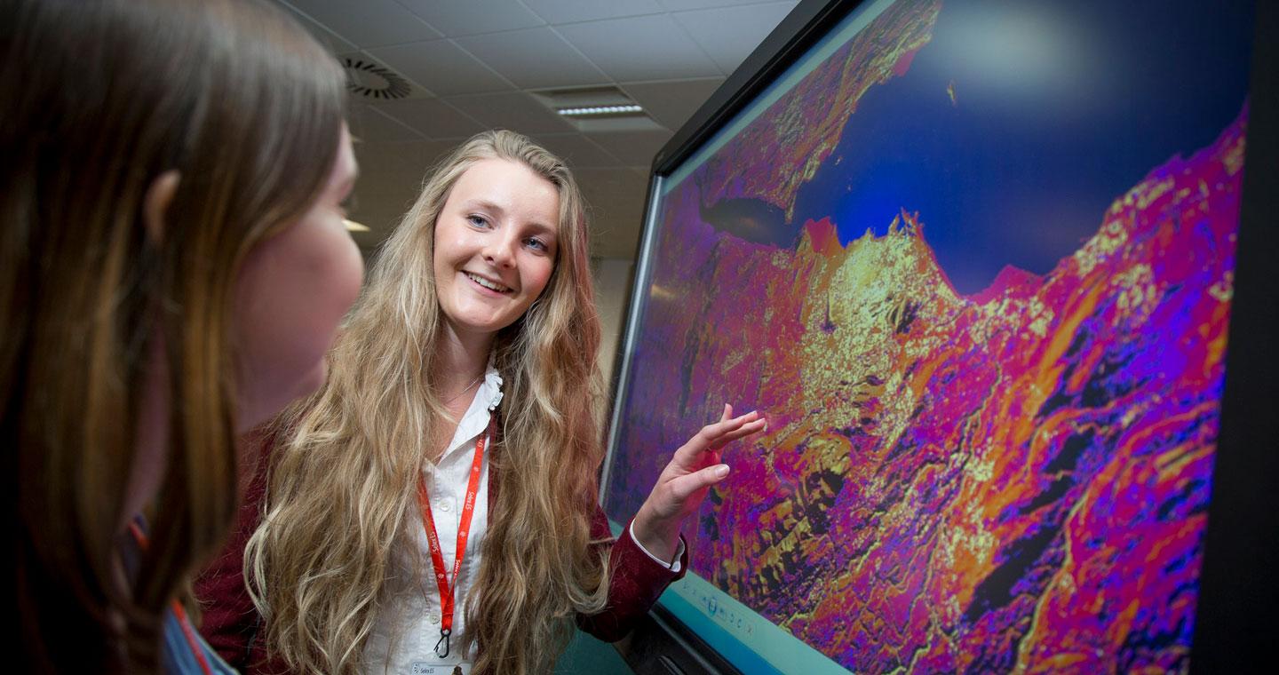 Girl points to thermal imaging picture on screen