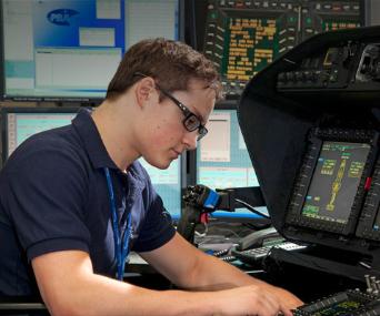 Young man in glasses works on radar