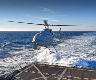 Fire Scout UAV coming into land on the back of a ship at sea