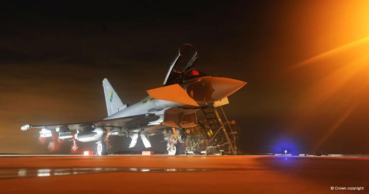 Night shot of lit up of Eurofighter Typhoon sitting on the tarmac 