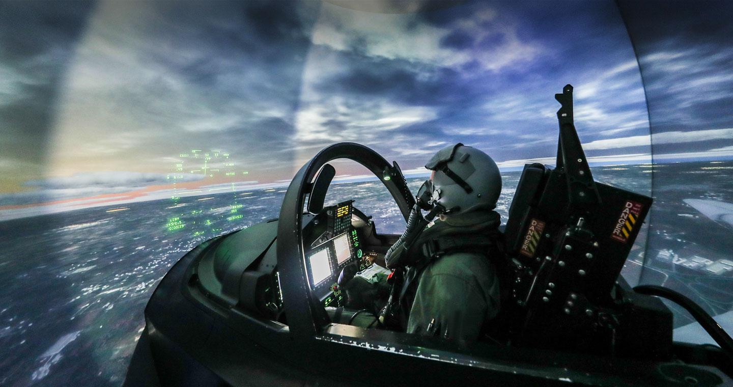 Pilot sitting in cockpit simulator