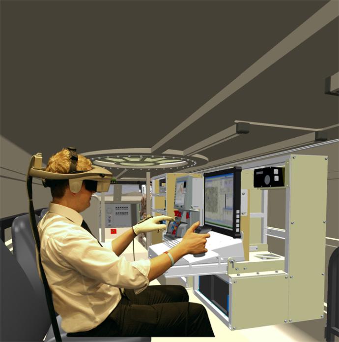 Man sitting inside Leonardo’s Virtual Interactive Development Environment wearing VR headset and gloves