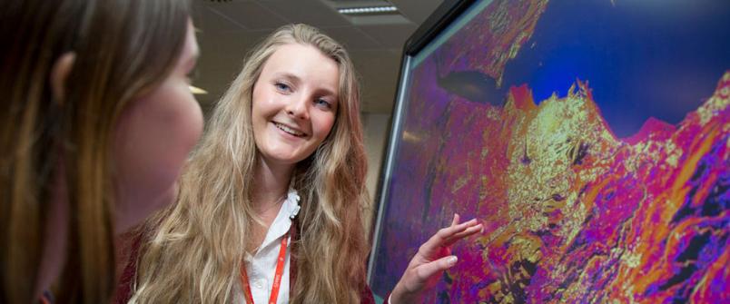 Girl points to thermal imaging picture on screen